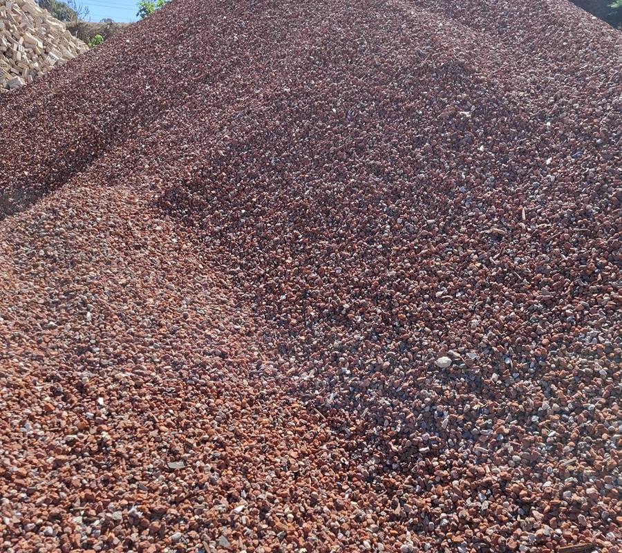 Red Crushed Brick (10-20mm) in use on a Perth job, supplied and delivered across Perth by Red Sand Supplies