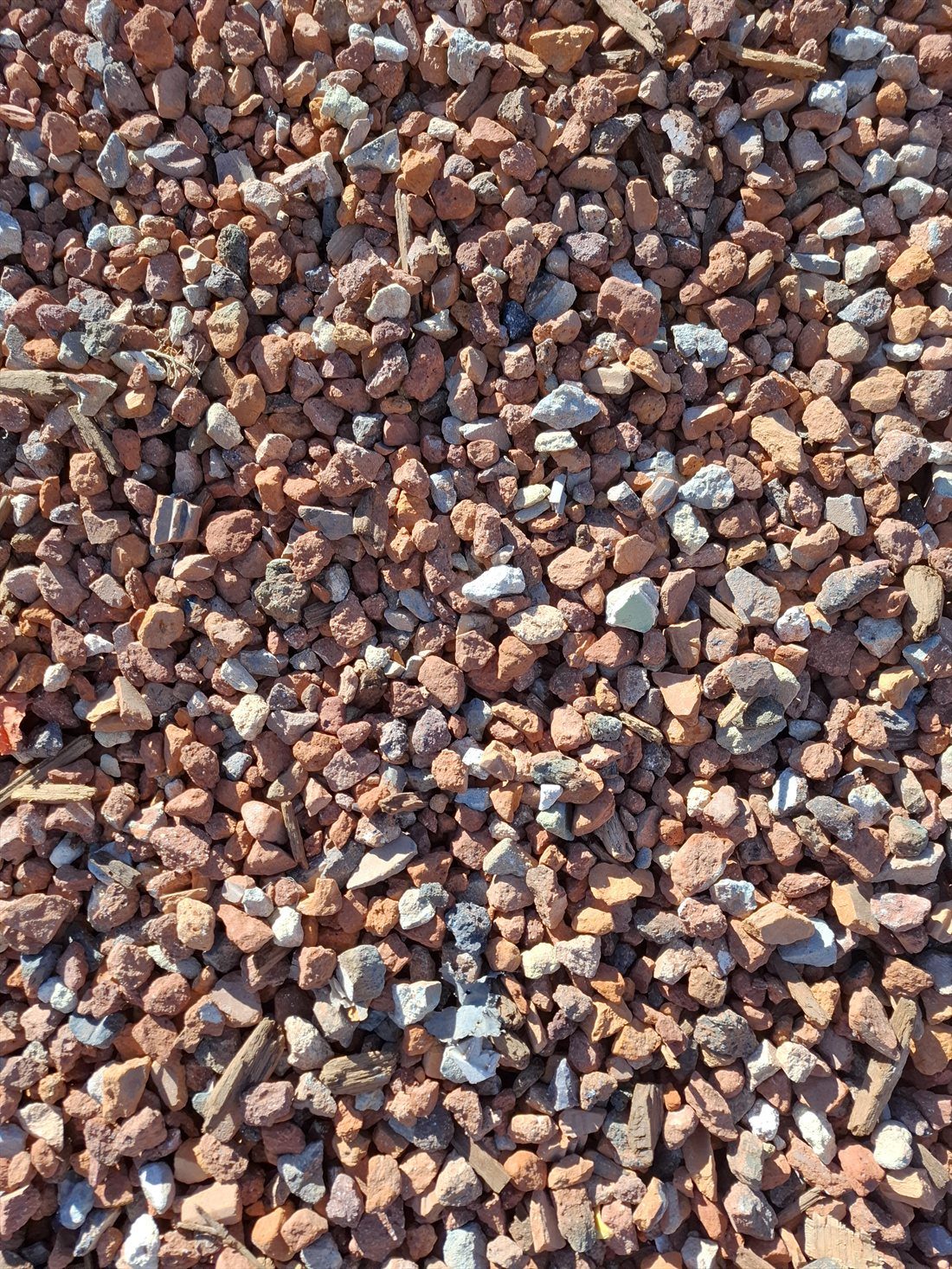 Red Crushed Brick (35mm) close up, supplied and delivered across Perth by Red Sand Supplies